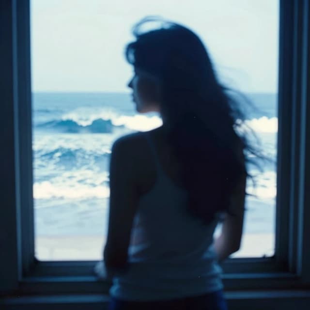 there is a blurry photo of a person looking out a window, blue monochromatic, tall backlit waves, 2 0 1 0, archival pigment print, with textured hair and skin, in motion, photoscanned, female photography