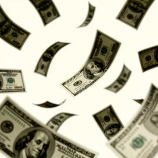 A close-up of a poster with money flying around, the album cover, no text