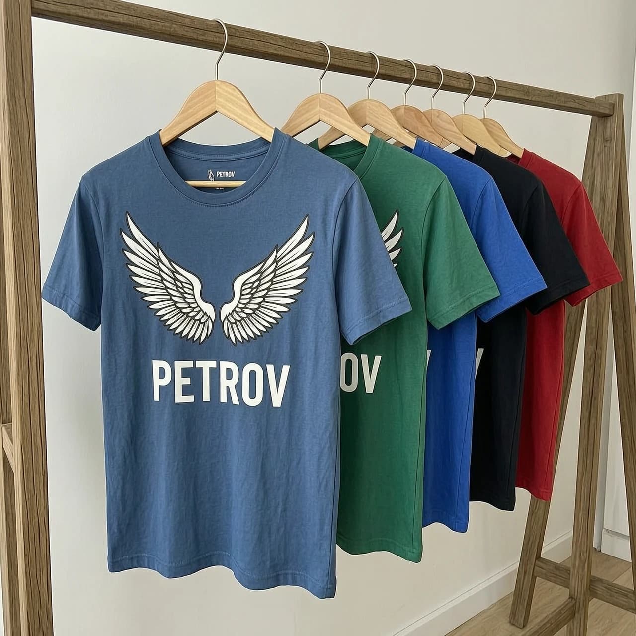 футболки на вешалках с рисунком крыльев и надписью PETROV
