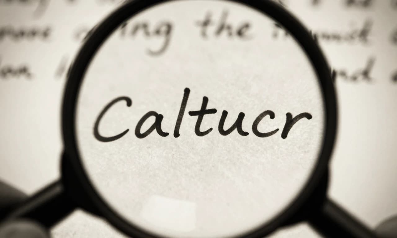 Extreme close-up of magnifying glass over handwritten letter text, single word highlighted, dramatic lighting, sepia